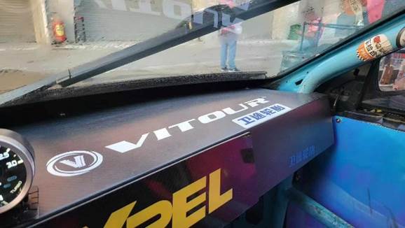 May be an image of 1 person, rear-view mirror and text